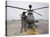 An Oh-58D Kiowa Warrior Pilot Stands Beside His Aircraft-null-Stretched Canvas