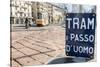 An old sign in Italian that says Trams go to Duomo, with a traditional Milanese tram in the backgro-Alexandre Rotenberg-Stretched Canvas