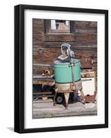 An old washing machine and old rusty stove on the porch of a building in ghost town.-Julie Eggers-Framed Photographic Print