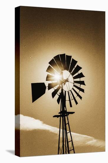 An Old Windmill Backlit In The Early Morning Light Along Highway 25 In San Benito County-Ron Koeberer-Stretched Canvas