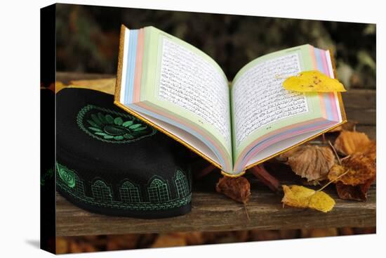 An open Holy Quran on wood stand and a kufi, France, Europe-Godong-Stretched Canvas