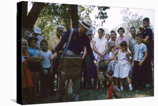 An Organ Grinder and His Monkey Perform at the Iowa State Fair, Des Moines, Iowa, 1955-John Dominis-Stretched Canvas