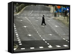 An Orthodox Israeli Jew Walks Across an Empty Road During the Sabbath-null-Framed Stretched Canvas
