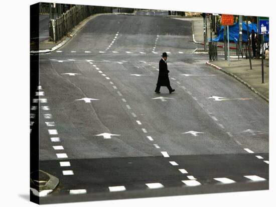 An Orthodox Israeli Jew Walks Across an Empty Road During the Sabbath-null-Stretched Canvas