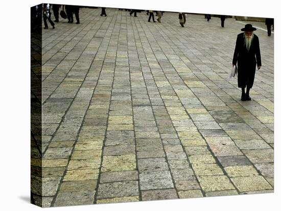 An Orthodox Israeli Jew Walks Across the Plaza Next to the Western Wall-null-Stretched Canvas