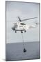 An SA-330 Puma Transport Helicopter Moves Cargo During a Vertical Replenishment-null-Mounted Photographic Print