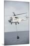 An SA-330 Puma Transport Helicopter Moves Cargo During a Vertical Replenishment-null-Mounted Photographic Print