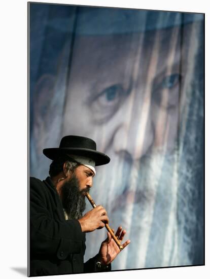 An Ultra-Orthodox Jewish Man Plays a Flute-null-Mounted Photographic Print