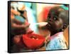 An Unidentified Baby is Fed at a Home for Hiv/Aids and Abandoned Children-null-Framed Stretched Canvas
