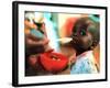 An Unidentified Baby is Fed at a Home for Hiv/Aids and Abandoned Children-null-Framed Photographic Print