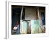 An Unidentified Boy Stands Outside a House-null-Framed Photographic Print