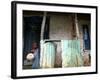 An Unidentified Boy Stands Outside a House-null-Framed Photographic Print