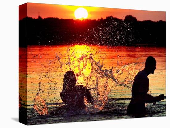 An Unidentified Couple Splashes in Lake Wandlitz Near Berlin on a Warm Evening-null-Stretched Canvas