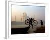 An Unidentified Cyclist Gets Down with His Cycle against the Backdrop of the Taj Mahal-null-Framed Photographic Print