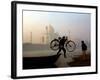 An Unidentified Cyclist Gets Down with His Cycle against the Backdrop of the Taj Mahal-null-Framed Photographic Print