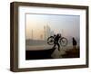 An Unidentified Cyclist Gets Down with His Cycle against the Backdrop of the Taj Mahal-null-Framed Photographic Print