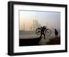 An Unidentified Cyclist Gets Down with His Cycle against the Backdrop of the Taj Mahal-null-Framed Photographic Print