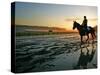 An Unidentified Horse and Rider on the Track at Sunrise at Belmont Park-null-Stretched Canvas