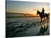 An Unidentified Horse and Rider on the Track at Sunrise at Belmont Park-null-Stretched Canvas