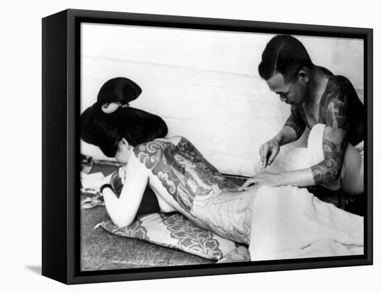 An Unidentified Japanese Tattoo Artist Works on a Woman's Backside-null-Framed Stretched Canvas