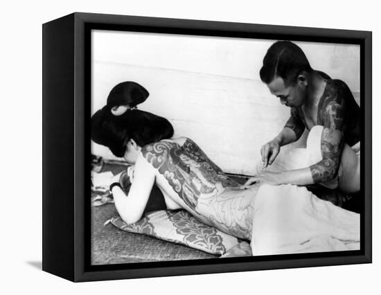 An Unidentified Japanese Tattoo Artist Works on a Woman's Backside-null-Framed Stretched Canvas