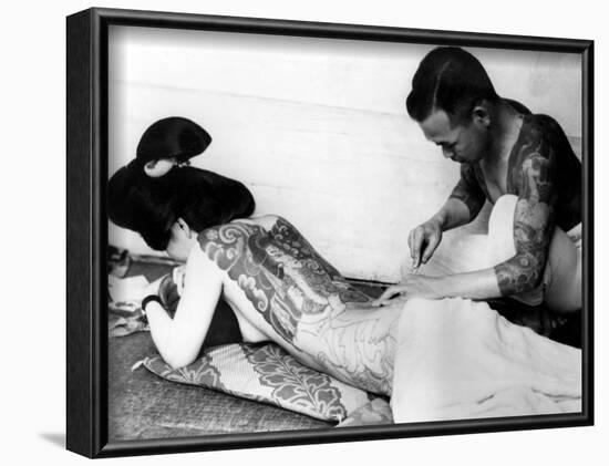 An Unidentified Japanese Tattoo Artist Works on a Woman's Backside-null-Framed Photographic Print