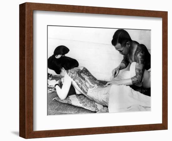 An Unidentified Japanese Tattoo Artist Works on a Woman's Backside-null-Framed Photographic Print