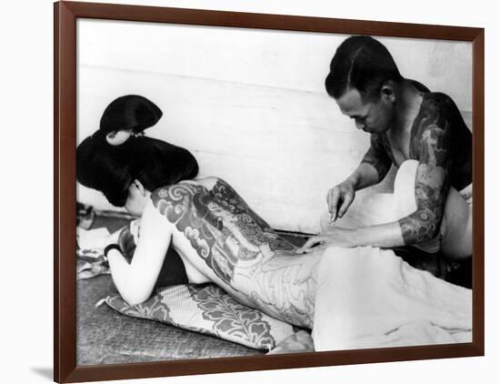 An Unidentified Japanese Tattoo Artist Works on a Woman's Backside-null-Framed Photographic Print