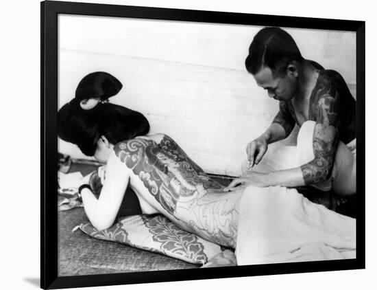 An Unidentified Japanese Tattoo Artist Works on a Woman's Backside-null-Framed Photographic Print