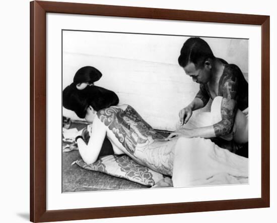 An Unidentified Japanese Tattoo Artist Works on a Woman's Backside-null-Framed Photographic Print