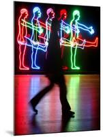 An Unidentified Visitor Passes an Art Installation by Bruce Naumann-null-Mounted Photographic Print