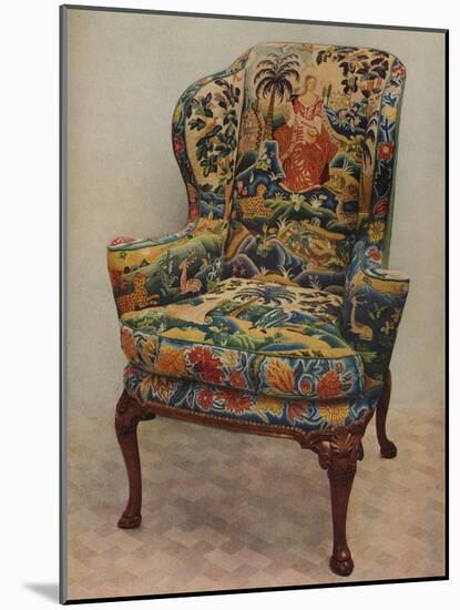 An upholstered armchair with wings, carved walnut frame and original silk needlework covering-Unknown-Mounted Photographic Print