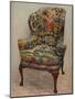 An upholstered armchair with wings, carved walnut frame and original silk needlework covering-Unknown-Mounted Photographic Print