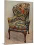 An upholstered armchair with wings, carved walnut frame and original silk needlework covering-Unknown-Mounted Photographic Print