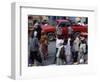 An Water Vendor Walks in the Streets of Port-Au-Prince, Haiti-null-Framed Photographic Print