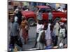 An Water Vendor Walks in the Streets of Port-Au-Prince, Haiti-null-Mounted Photographic Print