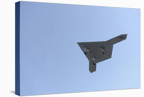 An X-47B Unmanned Combat Air System in Flight-null-Stretched Canvas