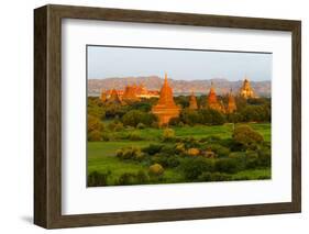 Ancient temple and pagoda rising out of the jungle at sunrise, Bagan, Mandalay Region, Myanmar-Keren Su-Framed Photographic Print