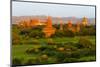 Ancient temple and pagoda rising out of the jungle at sunrise, Bagan, Mandalay Region, Myanmar-Keren Su-Mounted Photographic Print