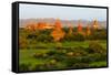 Ancient temple and pagoda rising out of the jungle at sunrise, Bagan, Mandalay Region, Myanmar-Keren Su-Framed Stretched Canvas