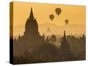 Ancient Temple City of Bagan (Pagan) and Balloons at Sunrise, Myanmar (Burma)-Peter Adams-Stretched Canvas