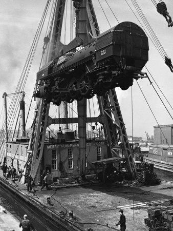 Locomotive Hoisted by Merritt-Chapman-Scott Crane Headed for France to Boost the Postwar Effort
