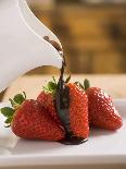 Pouring Chocolate Sauce over Fresh Strawberries-Andrew Pini-Laminated Photographic Print