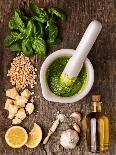 Sauce Pesto and its Ingredients on Rough Wood-Andrii Gorulko-Photographic Print