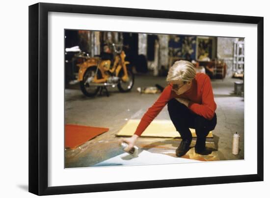 Andy with Spray Paint and Moped, The Factory, NYC, circa 1965-Nat Finkelstein-Framed Art Print