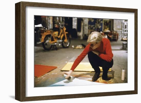 Andy with Spray Paint and Moped, The Factory, NYC, circa 1965-Nat Finkelstein-Framed Art Print