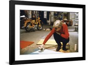 Andy with Spray Paint and Moped, The Factory, NYC, circa 1965-Andy Warhol/ Nat Finkelstein-Framed Giclee Print