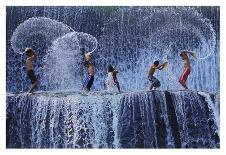 Playing Football-Angela Muliani Hartojo-Photographic Print