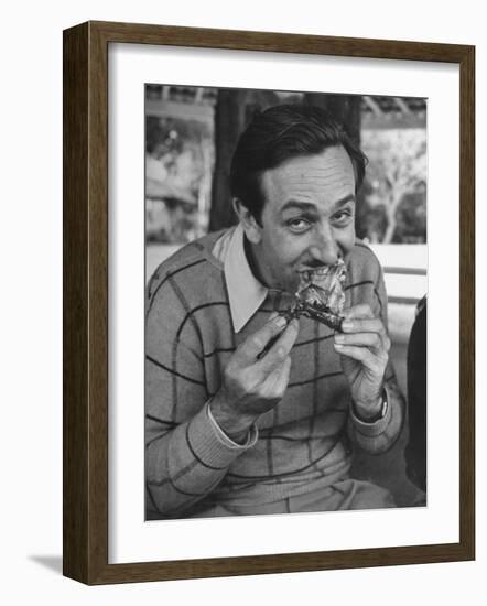 Animator and Movie Producer Walt Disney Eating Chicken-null-Framed Photographic Print