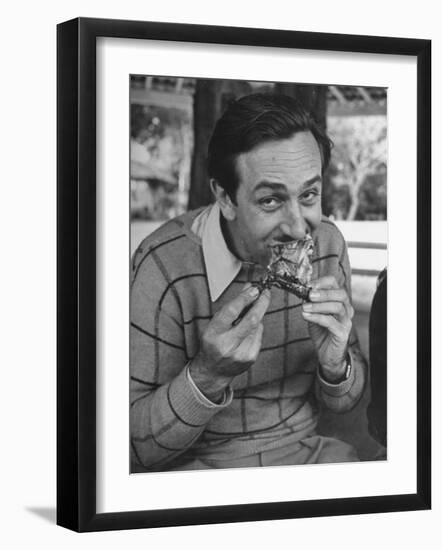 Animator and Movie Producer Walt Disney Eating Chicken-null-Framed Photographic Print